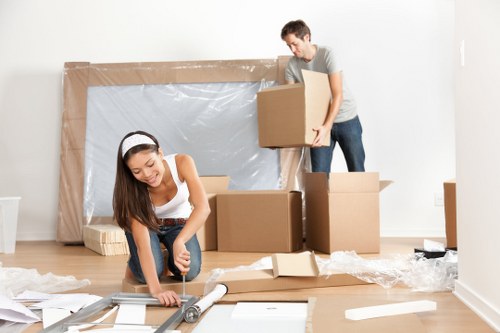 Packed office equipment and labelled boxes ready for office removals in Barnes