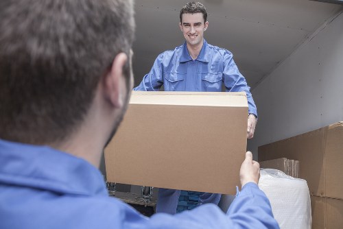 Moving van and furniture loading scene in Barnes