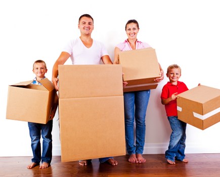 Moving van and boxes outside a Barnes home