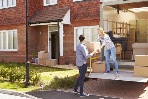 Student removals planning in Barnes with packed moving boxes