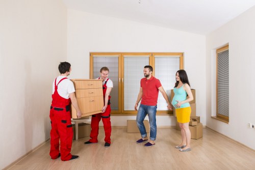 Team preparing access routes and protecting floors before moving items