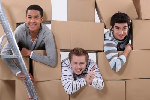 Removal team loading household items into a vehicle