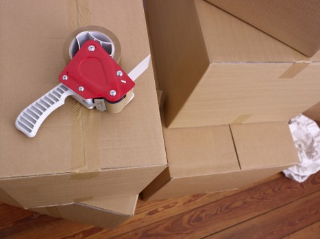 Packed boxes and furniture ready for removal services in Barnes