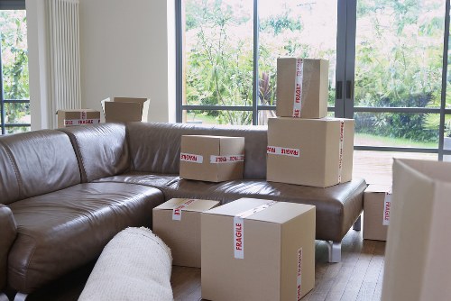 Professional movers carrying furniture during a Barnes relocation